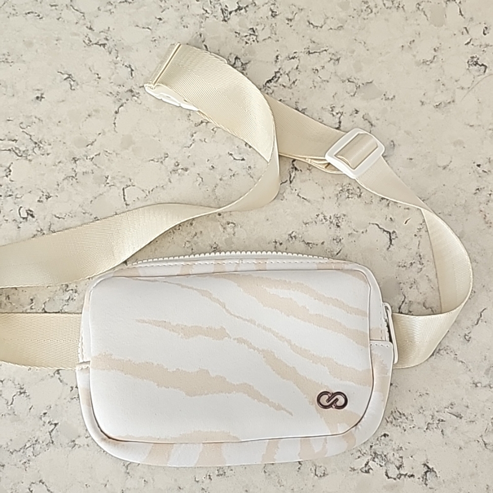 Calia by Carrie Underwood waist pack, neoprene bag, white zebra color